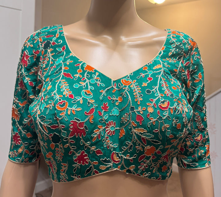 Green silk embroidered padded blouse