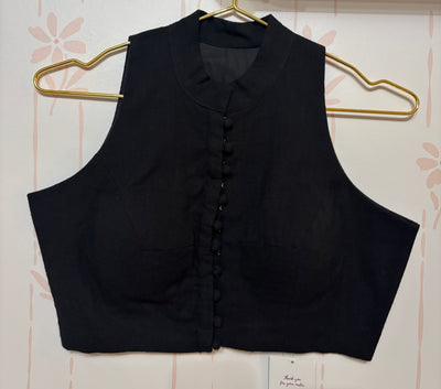 Black cotton sleeveless blouse with high neck
