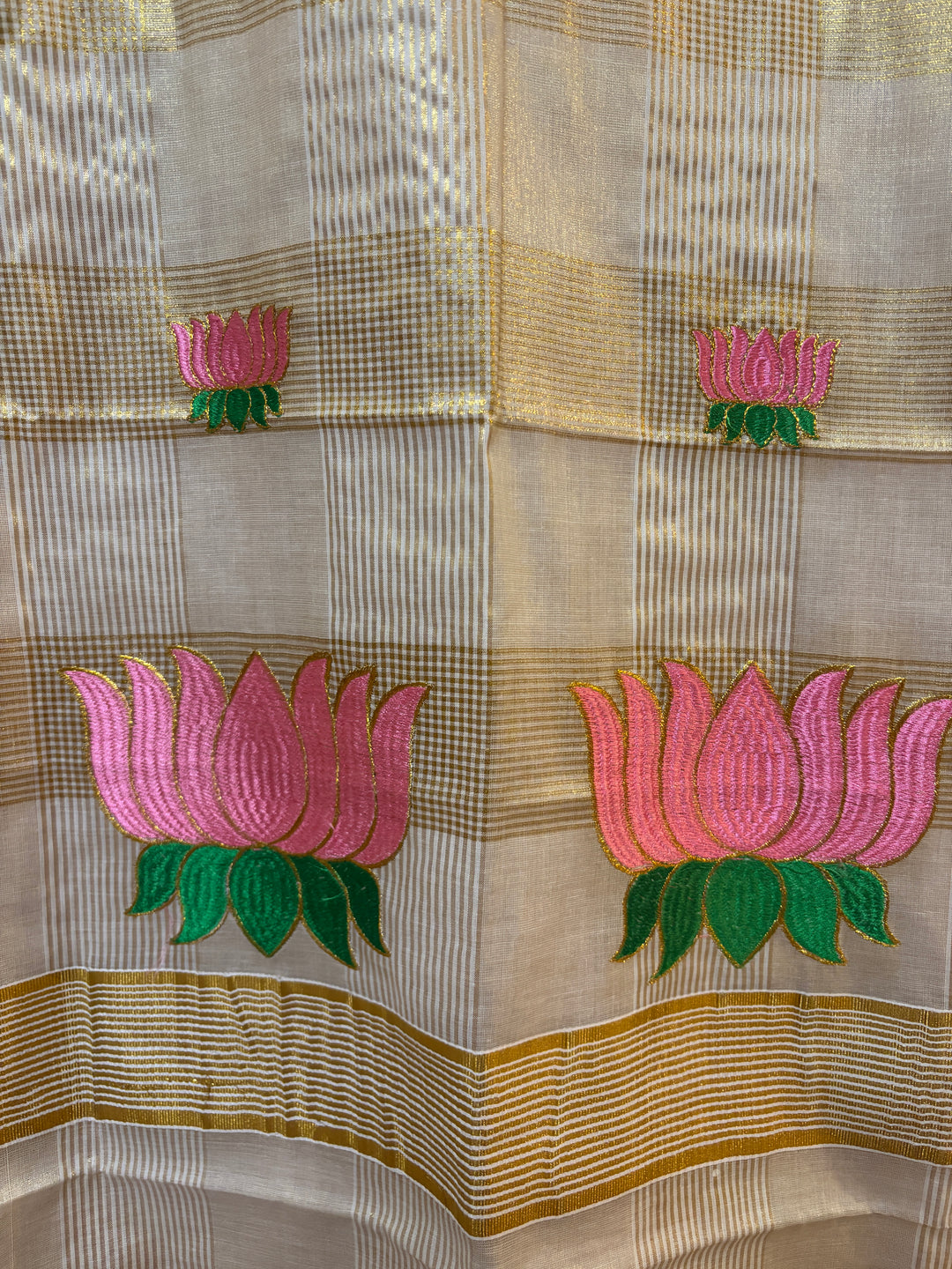 Kerala tissue saree with lotus embroidery and checks