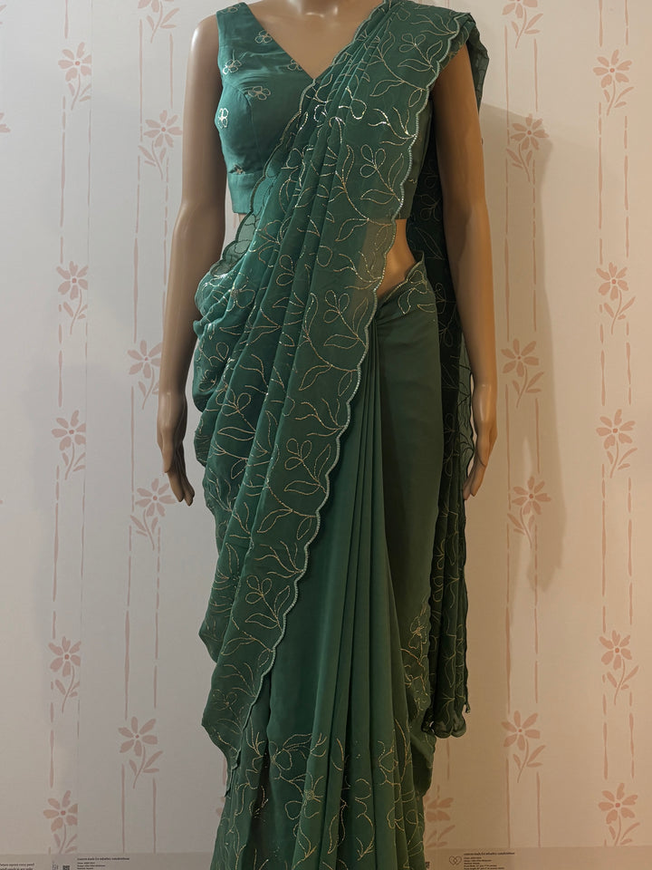 emerald green Pita work georgette saree and blouse set