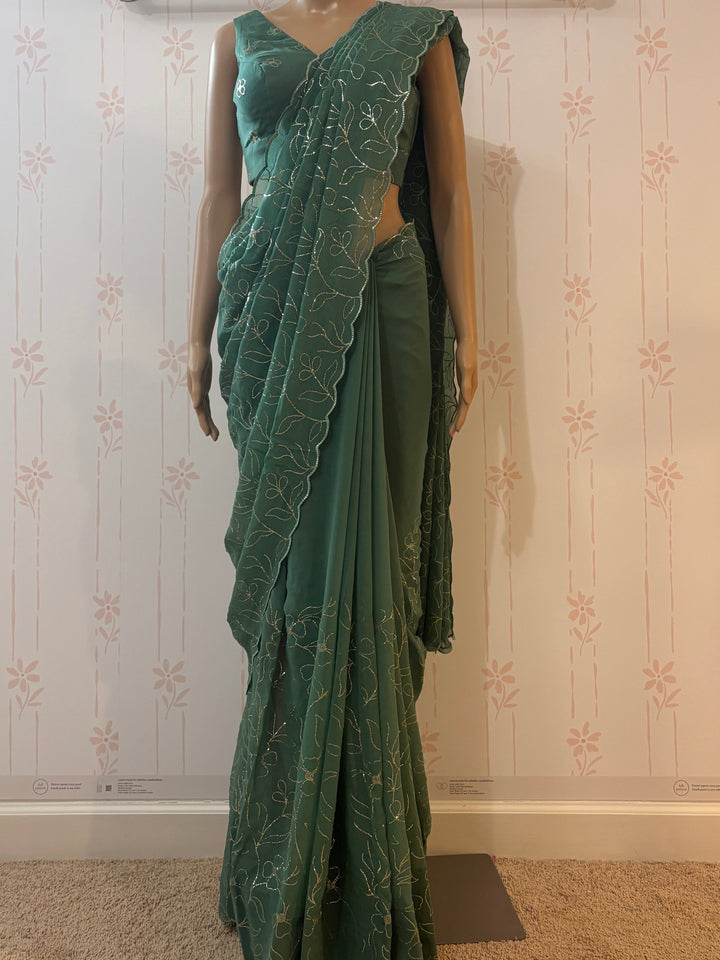 emerald green Pita work georgette saree and blouse set