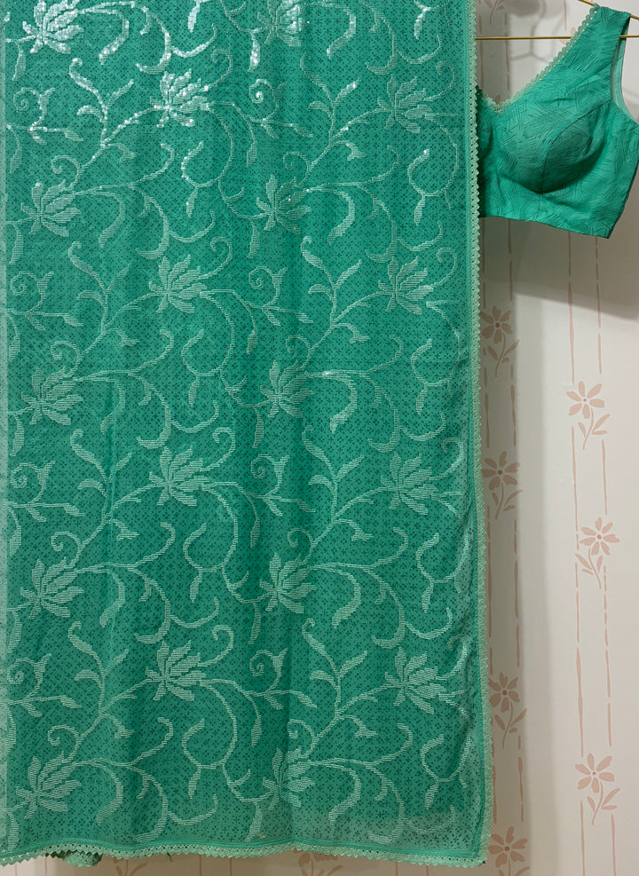 Sea green georgette saree and blouse set