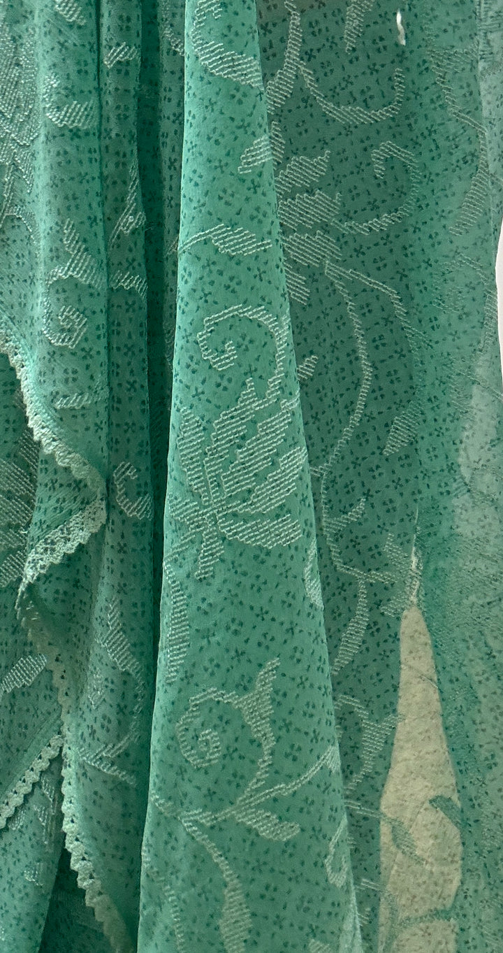 Sea green georgette saree and blouse set