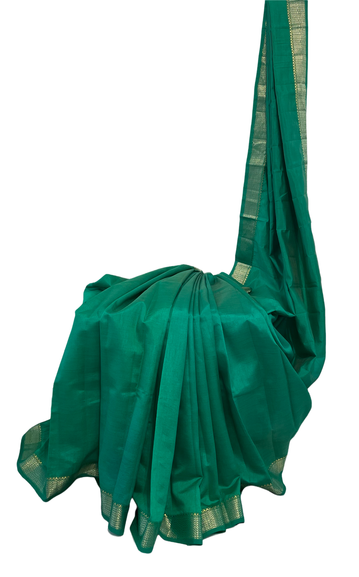 Emerald green tussar silk saree with gold and dull gold zari
