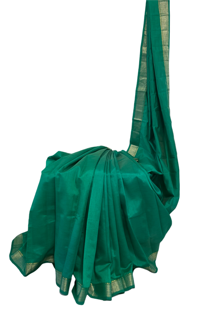 Emerald green tussar silk saree with gold and dull gold zari