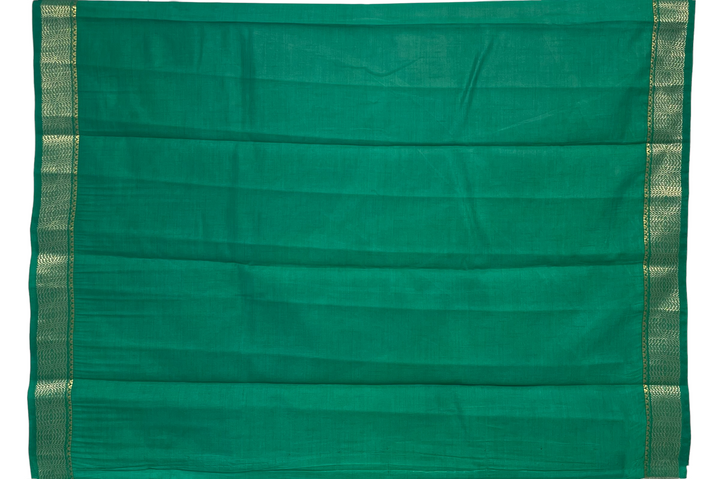 Emerald green tussar silk saree with gold and dull gold zari