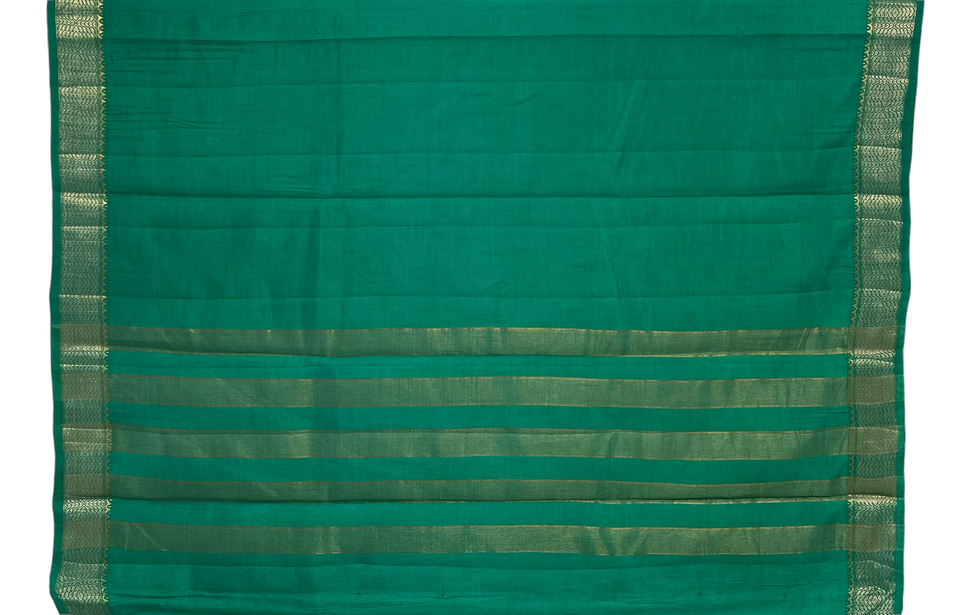 Emerald green tussar silk saree with gold and dull gold zari