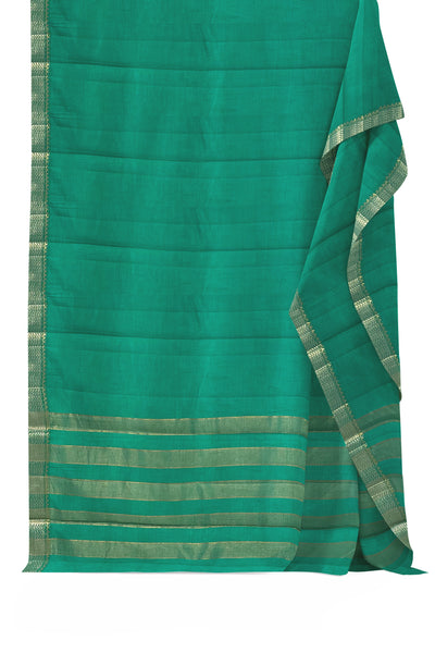 Emerald green tussar silk saree with gold and dull gold zari