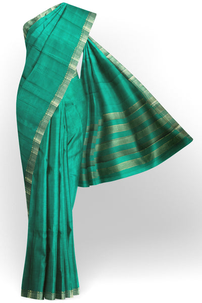 Emerald green tussar silk saree with gold and dull gold zari