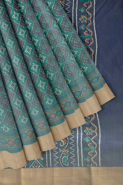 Green and violet Patola print silk saree with zari border