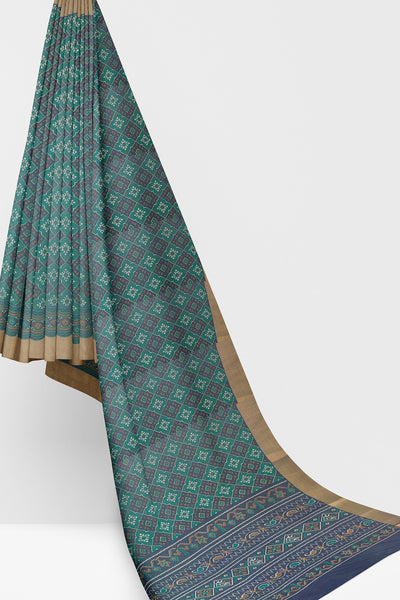 Green and violet Patola print silk saree with zari border