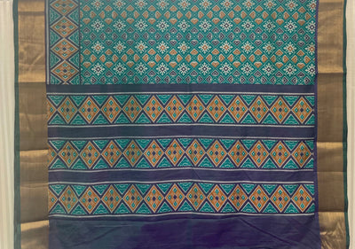 Green, violet, and mustard Patola print silk saree with zari border