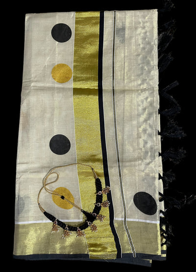 Kerala tissue saree with black polka dots