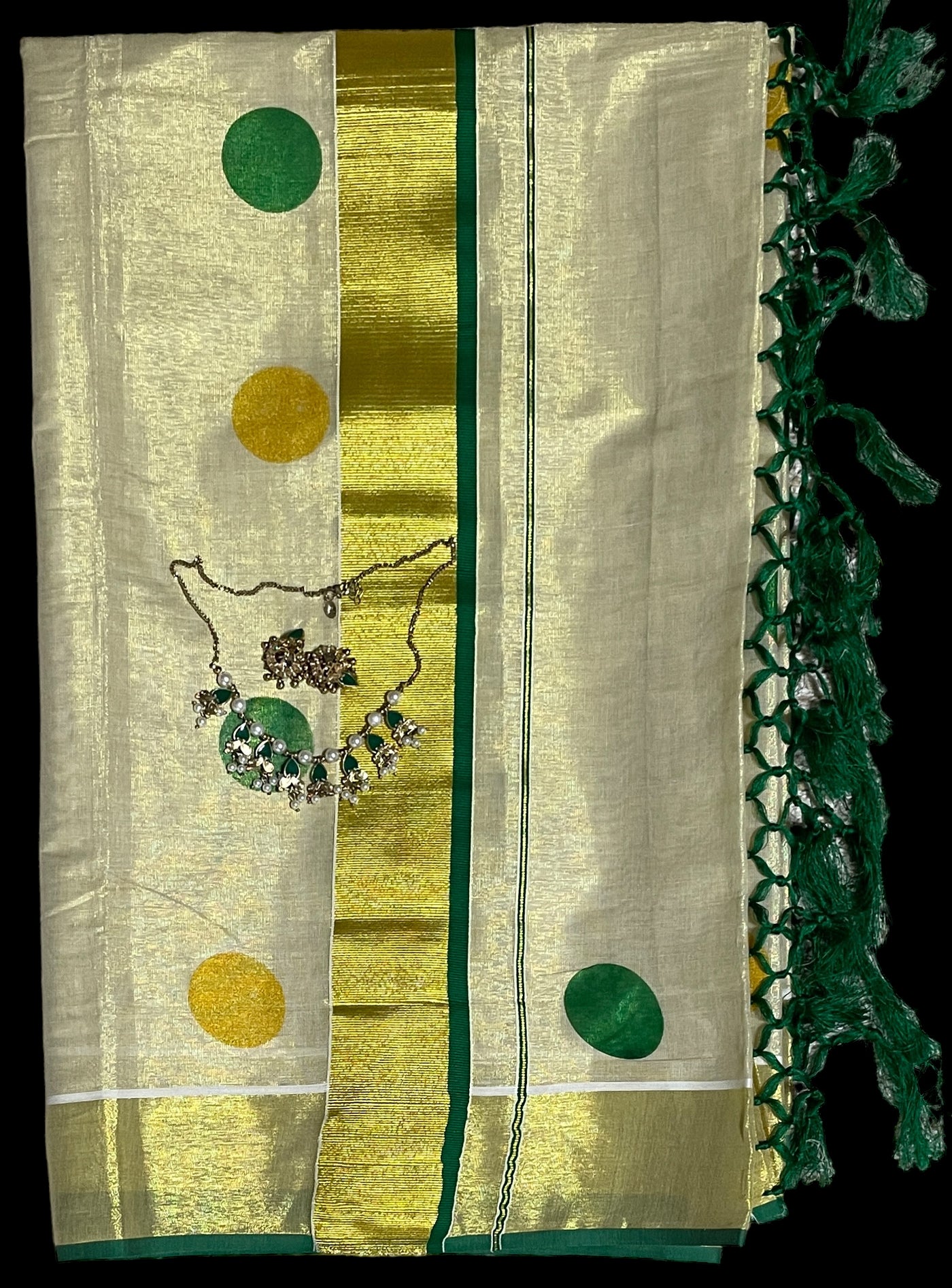 Kerala tissue saree with dark green polka dots