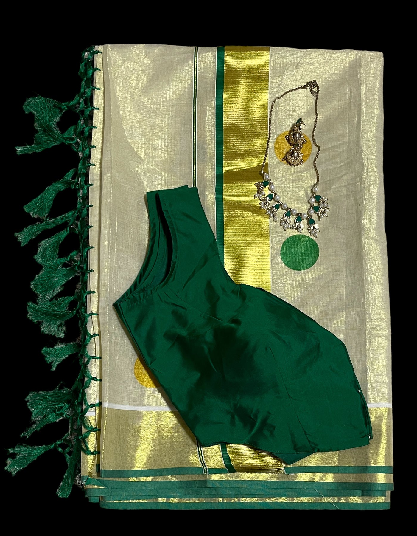 Kerala tissue saree with dark green polka dots