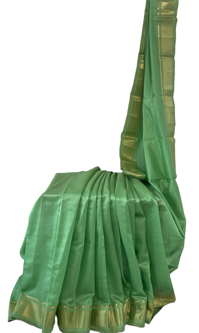 Pista green tussar silk saree with gold border